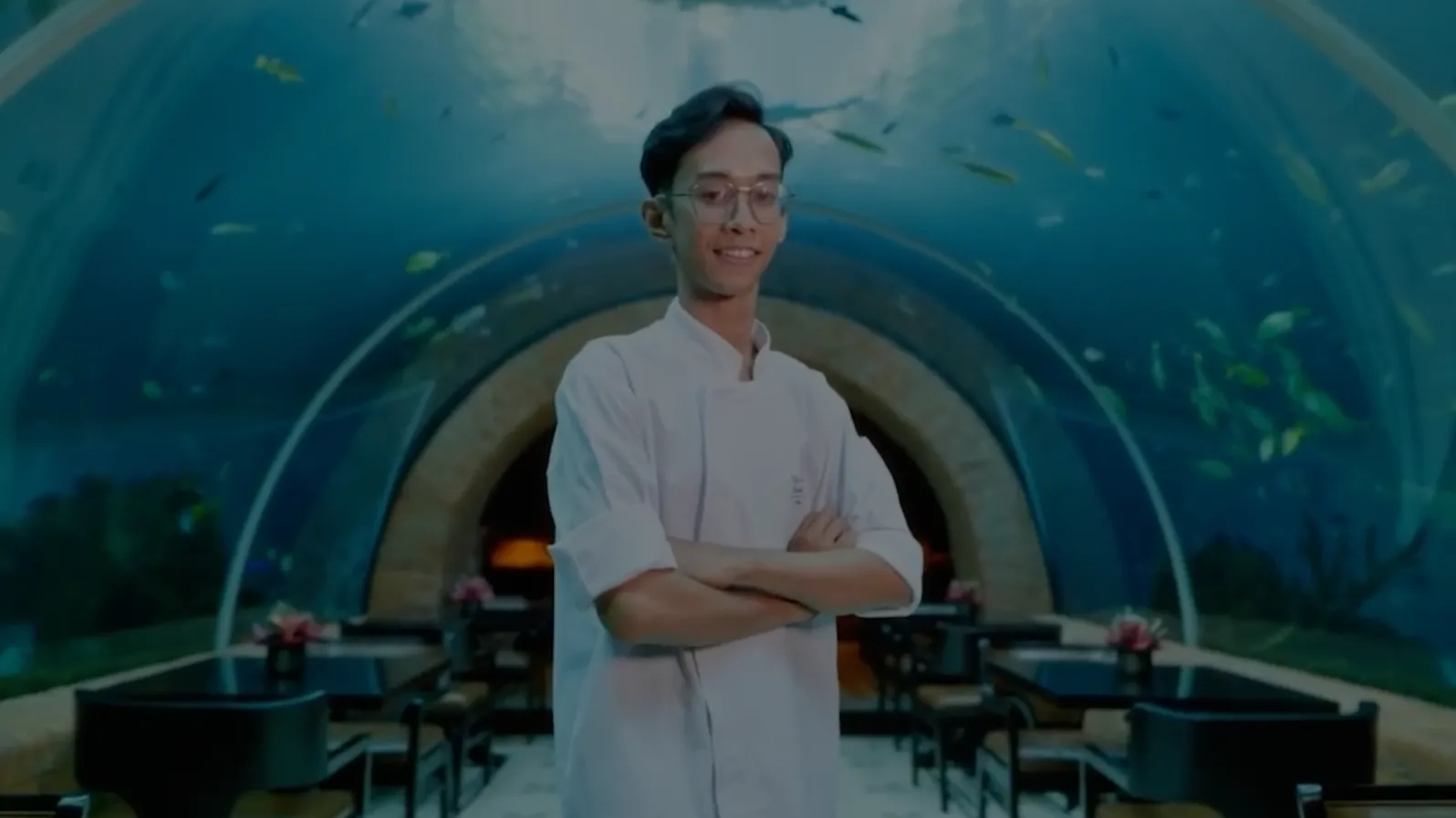 Video thumbnail of student in front of an aquarium